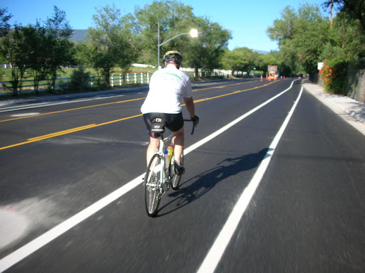 Roger Jacobson, head of Kiwanis Childrens Bicycle Program, rides a new bike lane on Mayberry