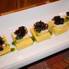 Polenta Cakes with Caramelized Onions, Brie and Basil Oil