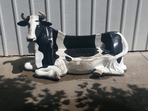 Cow Laying Down Sculpture