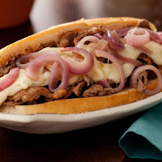 Philly Cheesesteaks with Melted Fontina and Sauteed Red Onions