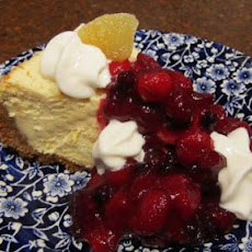 Festive Creamy Cheesecake With Tangy Cranberry Topping!