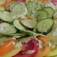 Tomato and Cucumber Salad With a Pesto Like Dressing.
