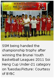 SSM being handed the championship trophy after winning the Brunei Youth Basketball Leagues 2011 Soi Heng Cup Under-21 category on Tuesday.Picture: Courtesy of BYBC 