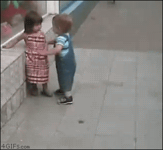boy approaches girl forcefully, she pushes him aside - animated GIF