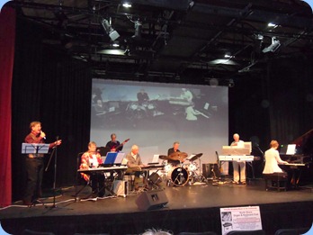 The North Shore Organ and Keyboard Club members playing for the first half the Concert at The PumpHouse Theatre 17th June 2012. Left to Right: Len Hancy; Barbara McNab; Brian Gunson; John Perkin; Ian Jackson; Peter Jackson; Denise Gunson.