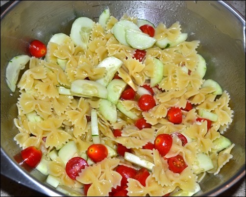 toss pasta and vegetables with sauce