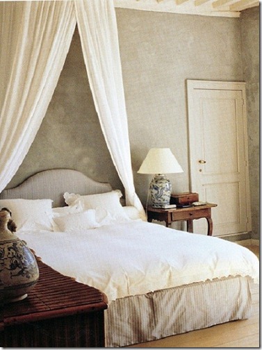 Axel Vervoordt Timeless Interiors gray bedroom with white linens