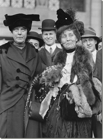 On the far left, American suffragist Lucy Burns (1879 - 1966) of the Congressional Union For Women Suffrage (CUWS) stands next to Mrs Emmeline Pankhurst (center) probably in Washington, DC, 1913. (Photo by PhotoQuest/Getty Images)
