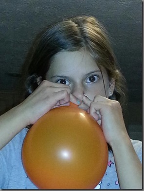 Rebkekah blowing balloon with nose