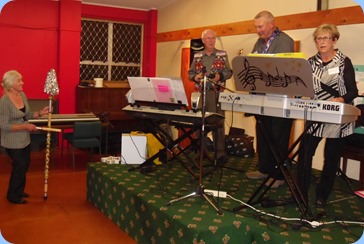Peter Brophy, Kevin and Jan Johnston doing their gig at the Raglan Club Saturday Night Concert. Delyse Whorwood couldn't contain her enthusiasm and took over the percussion section (seen on the left!).