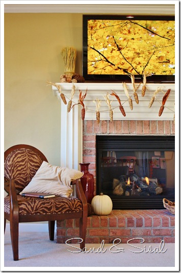Zebra chair with TV above fireplace (649x1024)