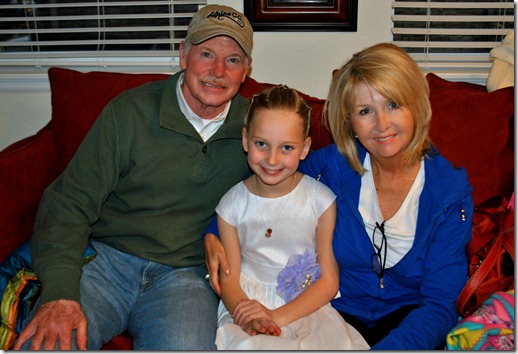 Halle with Grandma and Grandpa Banks. She's wearing the special necklace they gave her at her baptism