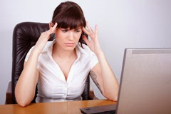 Businesswoman with stress related headache