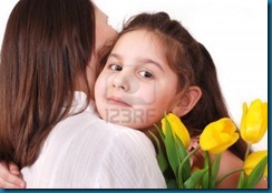 13281846-little-daughter-hug-her-mom-with-bouquet-of-yellow-tulips