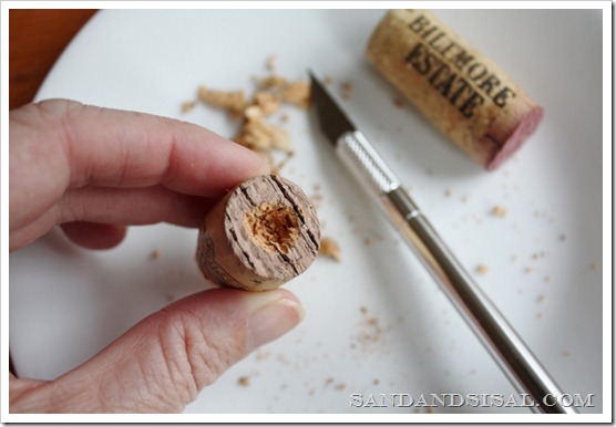 carve a small hole in cork