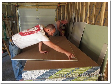 Jay cutting sheetrock for the Owen Workshop Petticoat Junktion