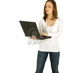 2549378-caucasian-girl-act-as-a-computer-geek-holding-up-black-laptop