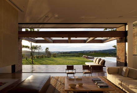 Living room in the foreground and landscape in the background Living room in the foreground and landscape in the background