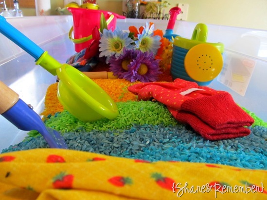 gardening and rainbow themed sensory bin for preschoolers - Rainbow Rice & Garden Sensory Play