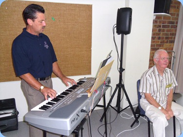 Peter LIttlejohn playing his Korg Pa1X whilst Peter Jackson prepares for his vocal session