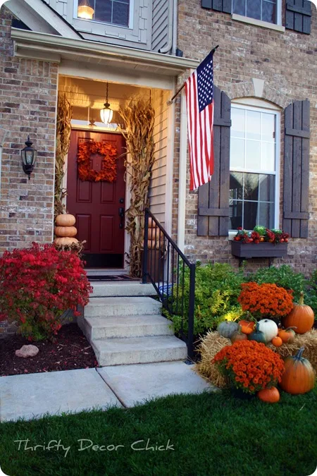 brick red door and fall decor