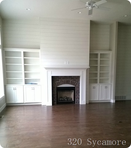 brick fireplace and built ins