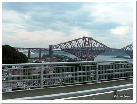 Firth of Forth rail bridge over North Queensferry. A cruise ship is berthed just around the corner.