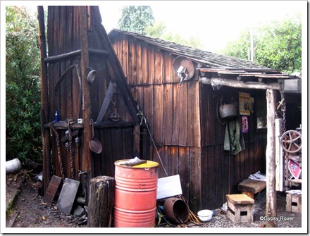 The bearded miners shack wooden chimney protected by strategically placed rocks inside. Note the satelitte dish. L.O.L