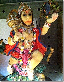Shri Hanuman lifting a mountain