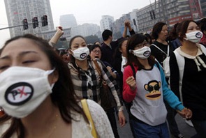 Protesters-shout-slogans-during-a-march-on-Sunday-against-plans-to-expand-a-petrochemical-plant-in-Ningbo-Zhejiang