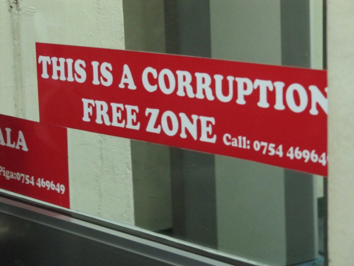 [October-16-2012-corruption-sign3.jpg]