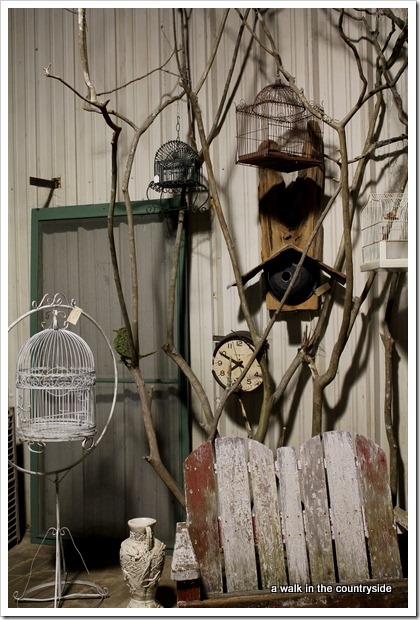 tree branches to display bird cages in antique booth