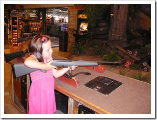 Practicing her aim at Bass Pro