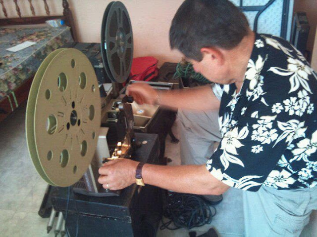 Missionary Ken Priebe from Power to Change inspects the Jesus Film equipment.
