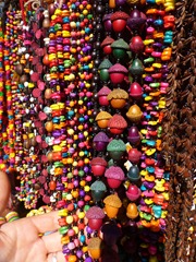 Colourful necklaces made from corn, nuts, and peas.