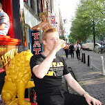 drinking a beer in front of bar tattoo in Amsterdam, Netherlands 