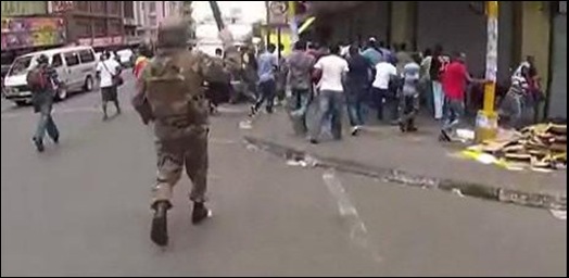 SA MILITARY MEN PATROLLING DOWNTOWN JOHANNESBURG RAIDING SHOPS OF UNARMED FOREIGN TRADERS FEB 12 2012 with cops firedept VIDEO by Adrian de Kock