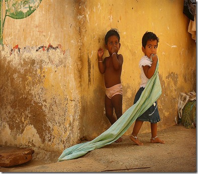 -indian-children-near-yellow-wall-in-the-village-of-kanyakumari-anastasiia-kononenko