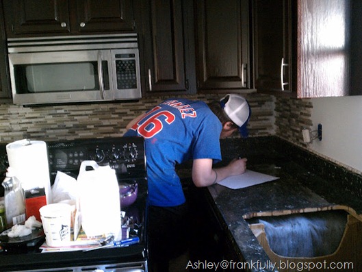 Ashley's husband Eric helping with the tile