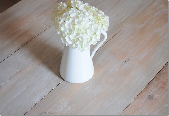 plank table with flowers