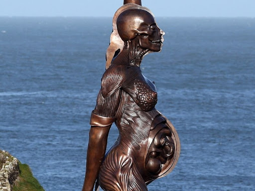Pregnant woman naked concrete body statue