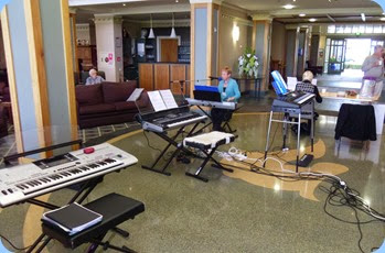 Some of the keyboards set-up in the atrium with the main lounge to the left and the dining area to the right.