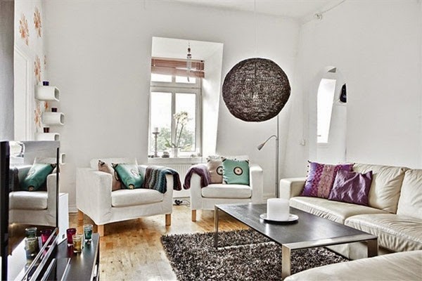 Modern-soft-living-room-design-with-white-sofa-black-table-carpet-blue-and-purple-pillow-lamp-window-hardwood-floor-design