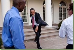 President Barack Obama practices his pitching form with personal aide Reggie Love and Jake Levine in the Rose Garden of the White House, March 31, 2010. Later that day, the President threw out the first pitch on opening day of the baseball season prior to the game between the Washington Nationals and the Philadelphia Phillies.   This official White House photograph is being made available only for publication by news organizations and/or for personal use printing by the subject(s) of the photograph. The photograph may not be manipulated in any way and may not be used in commercial or political materials, advertisements, emails, products, promotions that in any way suggests approval or endorsement of the President, the First Family, or the White House.  