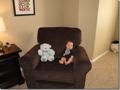 4.  Sitting in chair with bear