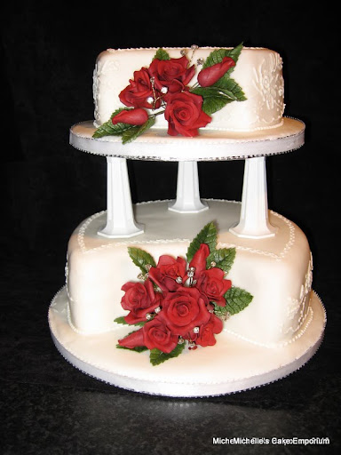 Beautiful 2 tier wedding cake with deep red sugar roses
