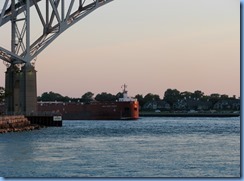 3716 Ontario Sarnia - Blue Water Bridge over St Clair River at sunset - Great Lakes Trader barge being pushed by the tug Joyce L. VanEnkevort