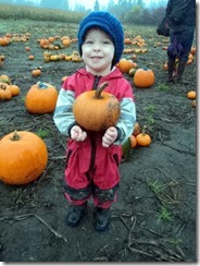 Saylor holding his pumpkin