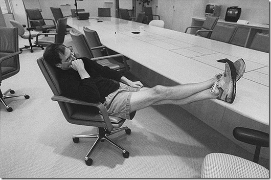Apple Computer head Steve Jobs deep in thought, propping sneakered feet on conference table in boardroom at Apple HQ day before heading to Boston for MacWorld Expo to announce Apple alliance w. Microsoft.  (Photo by Diana Walker//Time Life Pictures/Getty Images)