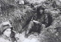 c0 Soldies in a foxhole, WWII.